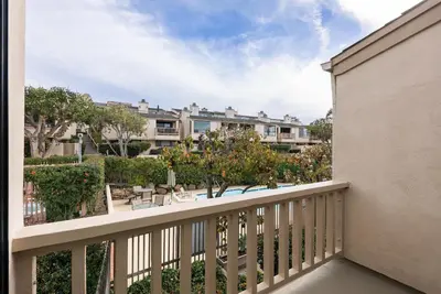 a balcony with a view of a resort at Sea For Miles - SUR93S in Solana Beach