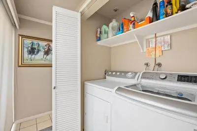 a laundry room with a washer and dryer at Sea For Miles - SUR93S in Solana Beach