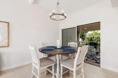 a dining room with a table and chairs at Solana Escape - SUR44 in Solana Beach