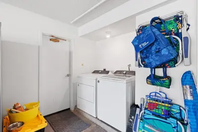 a laundry room with a washer and dryer at Mermaid's Lookout in San Diego