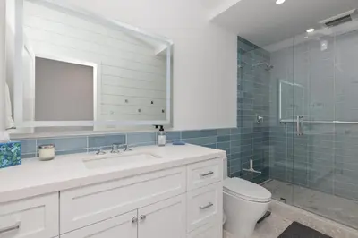 a bathroom with a sink and a toilet and a shower at King of the Beach - SUR79 in Solana Beach