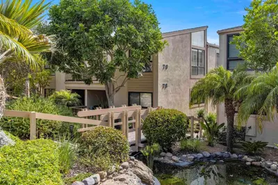 a house with a pond in front of it at King of the Beach - SUR79 in Solana Beach