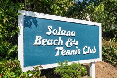 a blue sign for a beach and tennis club at Ocean Whisper - SBTC238 in Solana Beach