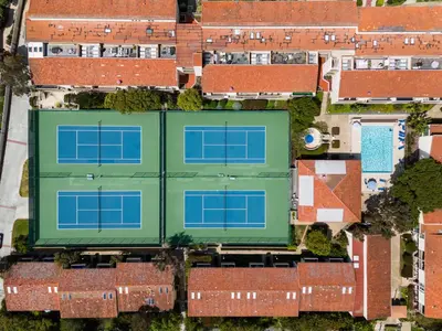 an overhead view of a building with four tennis courts at Ocean Whisper - SBTC238 in Solana Beach