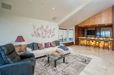 a living room with a couch and a table at Enchanting Oasis - SONG72 in Solana Beach