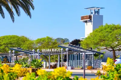 a parking lot with a gate and a control tower at Enchanting Oasis - SONG72 in Solana Beach