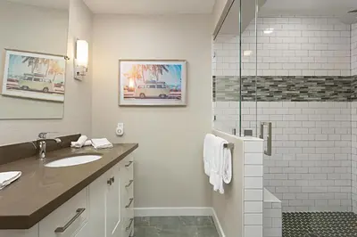 a bathroom with a sink and a shower at Coastal Retreat- SUR33 in Solana Beach