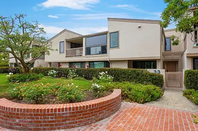 a brick walkway in front of a house at Coastal Retreat- SUR33 in Solana Beach