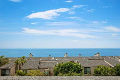 a row of houses with the ocean in the background at Coastal Retreat- SUR33 in Solana Beach