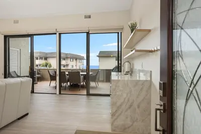 a kitchen and dining room with a view of the ocean at Pacific Bliss - DMBC767 in Solana Beach