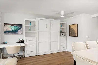 a white office with a desk and a white cabinet at Fairway Haven - CB2507 in Carlsbad