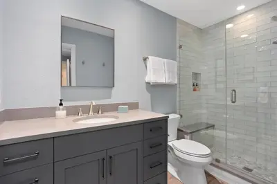 a bathroom with a sink and a toilet and a shower at Aqua Horizon - SBTC112 in Solana Beach