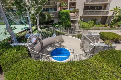 an empty pool with a playground in a yard at Aqua Horizon - SBTC112 in Solana Beach