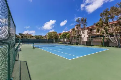 a tennis court with two tennis rackets on it at Aqua Horizon - SBTC112 in Solana Beach