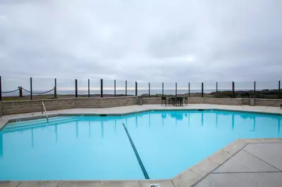 a large swimming pool with blue water at Villa del Pacifico - SONG20 in Solana Beach
