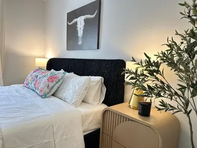 a bedroom with a bed and a potted plant at Close to Irvine IVC&UCI gate community2b &3b house more than 30nights in Irvine