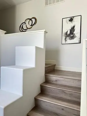 a staircase in a home with white and wood floors at Close to Irvine IVC&UCI gate community2b &3b house more than 30nights in Irvine