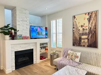a living room with a fireplace and a tv at Close to Irvine IVC&UCI gate community2b &3b house more than 30nights in Irvine