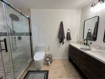 a bathroom with a shower and a toilet and a sink at Serenity - Amazing Views & Modern Charm in La Mesa