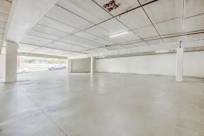 a large empty parking lot with a parking garage at Hotel Avenida, San Clemente Beach in San Clemente