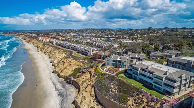 an aerial view of a beach with buildings and the ocean at SandyToes-SunKist Nose-CHAT2 in Solana Beach