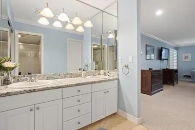 a bathroom with two sinks and a large mirror at Dolphin View - SUR43 in Solana Beach