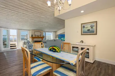 a dining room with a dining table and chairs at Dolphin View - SUR43 in Solana Beach