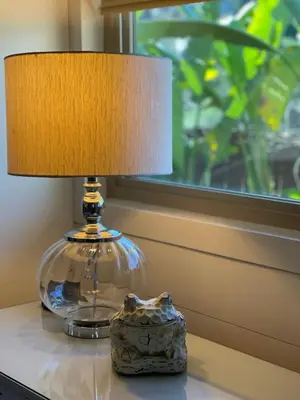 a lamp sitting on a table next to a window at Avocado House in El Cajon