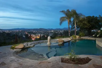 a swimming pool with a view of a city at Avocado House in El Cajon