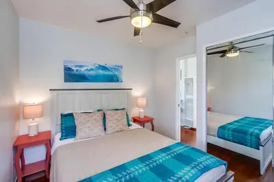 a bedroom with a bed and a ceiling fan at Manhattan Shores 1A in San Diego