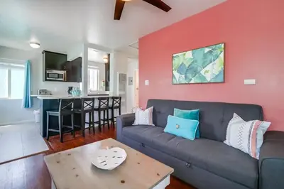 a living room with a couch and a table at Manhattan Shores 1A in San Diego