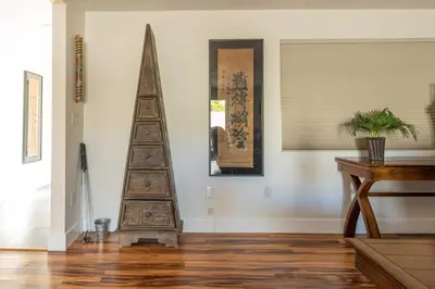 a wooden christmas tree sitting in a living room at Poker and Golf Club, Stream movies & Sports in San Diego