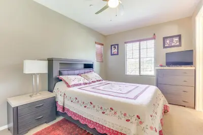 a bedroom with a bed and a ceiling fan at 14 Mi to Old Town Temecula Luxe Fallbrook Home! in Fallbrook