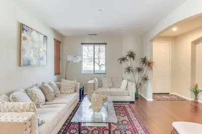 a living room with a couch and a table at 14 Mi to Old Town Temecula Luxe Fallbrook Home! in Fallbrook