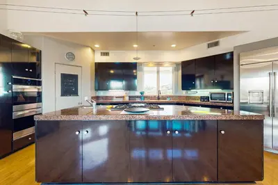 a large kitchen with a large island in the middle at Canyon Paradise in Encinitas
