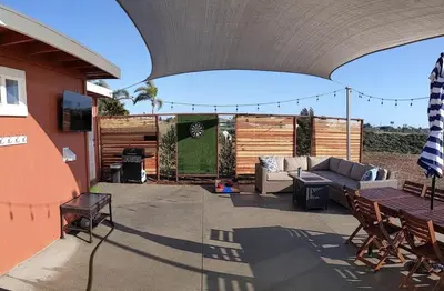 a patio with a couch and a table at Home to enjoy the beach with ocean view in Oceanside