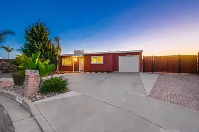a home with a driveway and a house at Home to enjoy the beach with ocean view in Oceanside