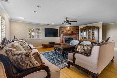 a living room with two couches and a fireplace at Temecula Valley Private Estate Panoramic Mountain & Pool Views in Murrieta