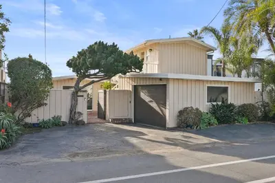 a house with a parking lot in front of it at Oceanfront Paradise on Neptune in Encinitas