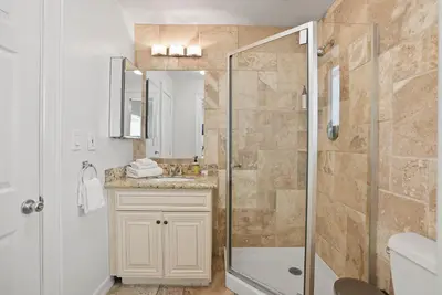 a bathroom with a shower and a sink at Beachfront Getaway with Ocean Views and Private Patio in Newport Beach
