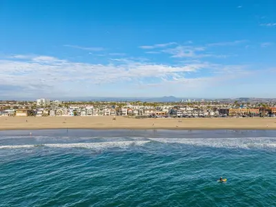 a view of a beach with a city and the ocean at Beachfront Getaway with Ocean Views and Private Patio in Newport Beach