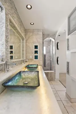 a bathroom with two sinks and a large tub at Beachfront Retreat with Ocean Views Private Rooftop Deck Walk to Pier and Town in Newport Beach