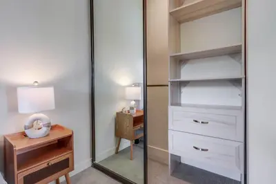 a dressing room with a mirror and a desk at 2nd floor A-C steps to beach downtown La Jolla in San Diego
