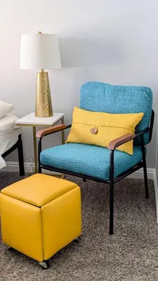 a blue chair and a yellow ottoman in a room at Poolside 2BR Condo with Balcony & Workspace in San Diego