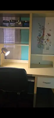 a desk with a chair in front of a table at Choice of comfort in Hemet