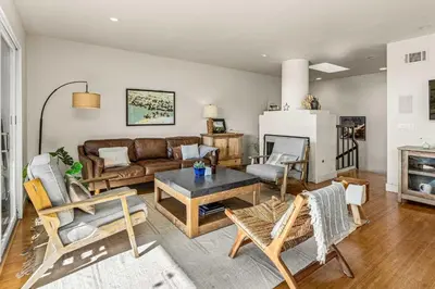 a living room with a couch and a table at Coastal View at Torrey Pines townhouse in San Diego