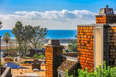 a view of the beach from the roof of a building at Coastal View at Torrey Pines townhouse in San Diego