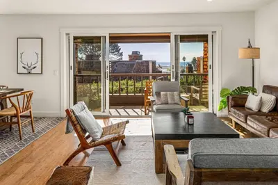a living room with a couch and a table at Coastal View at Torrey Pines townhouse in San Diego