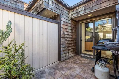 a front door of a house with a fence at Coastal View at Torrey Pines townhouse in San Diego