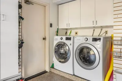 a laundry room with two washing machines in it at Coastal View at Torrey Pines townhouse in San Diego